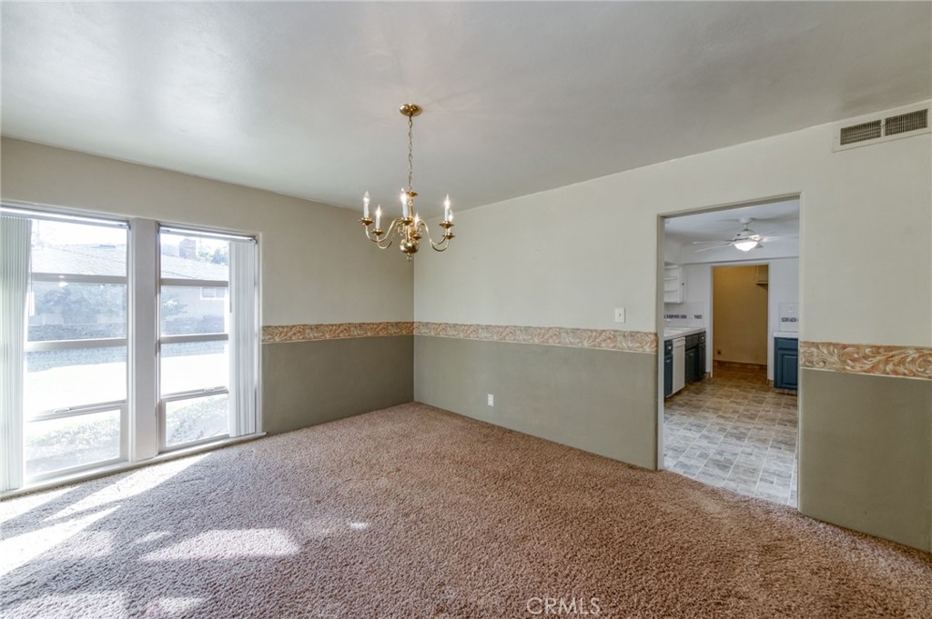 610 Park Madera, CA 93637 - Photo 18 of 35 a view of a big room with windows and chandelier fan