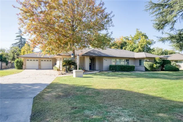 a view of house with outdoor space and swimming pool