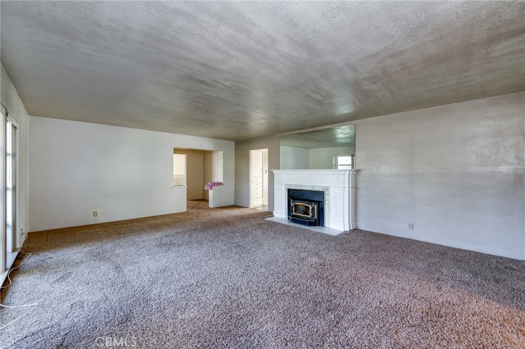 610 Park Madera, CA 93637 - Photo 9 of 35 an empty room with a fireplace