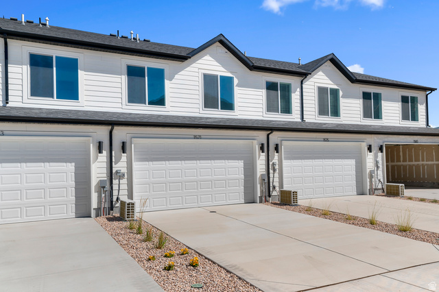 1851 East Corriente Drive, Unit 1166 Salem, UT 84653 - Photo 15 of 16 View of front facade featuring a garage, roof with shingles, and driveway