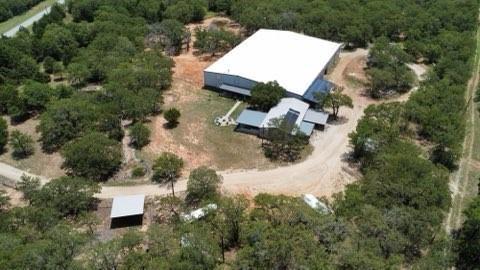 1990 Jim Harry Loop Sunset, TX 76270 - Photo 33 of 39 an aerial view of a house with a yard and trees