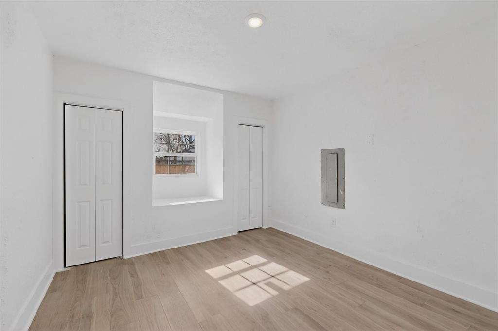 9918 Cedar Mountain Circle Dallas, TX 75217 - Photo 21 of 23 a view of empty room with wooden floor and fan