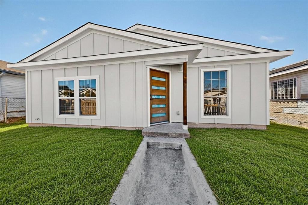 9918 Cedar Mountain Circle Dallas, TX 75217 - Photo 3 of 23 a front view of a house with a yard