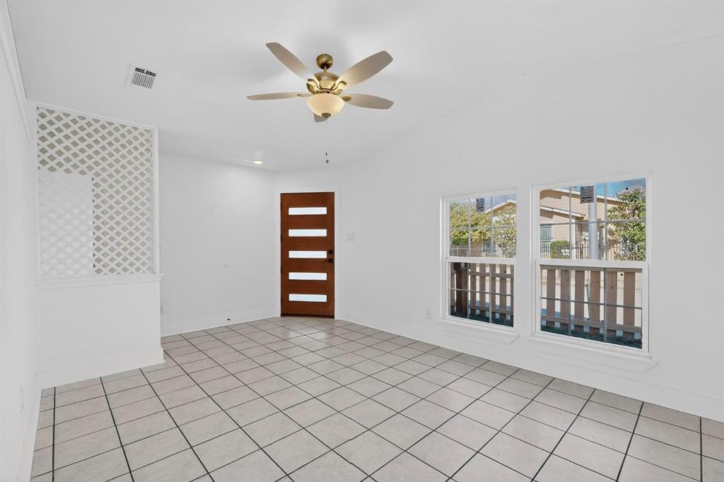 9918 Cedar Mountain Circle Dallas, TX 75217 - Photo 7 of 23 a view of an empty room with a window