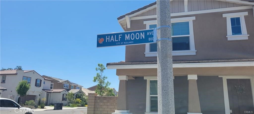 833 Half Moon Avenue Redlands, CA 92374 - Photo 4 of 6 a street sign on a pole on a street