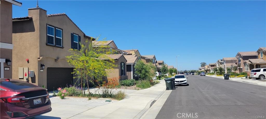 833 Half Moon Avenue Redlands, CA 92374 - Photo 5 of 6 a car parked in front of a building