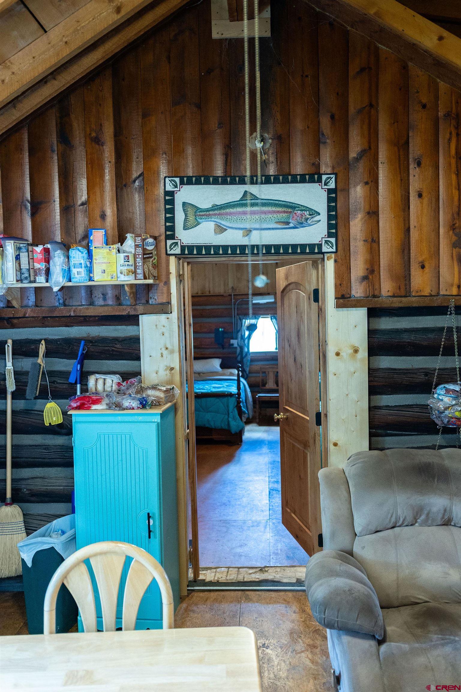 4650 Usfs Rd 516 Creede, CO 81130 - Photo 22 of 33 a living room with furniture and a fireplace
