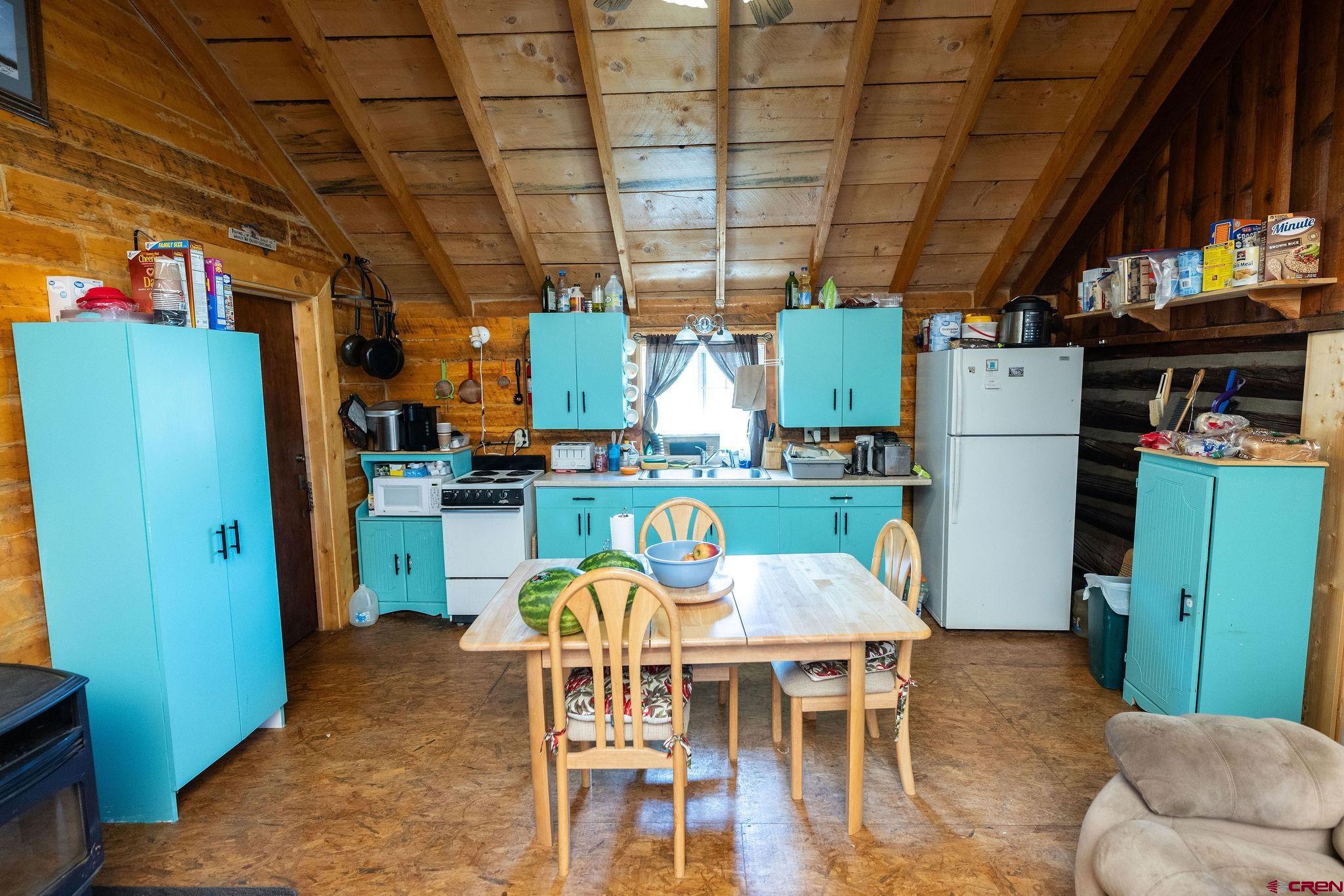 4650 Usfs Rd 516 Creede, CO 81130 - Photo 7 of 33 a dining room with furniture and a kitchen view
