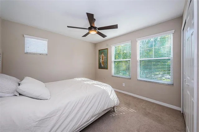 a view of swimming pool with a garden and seating area