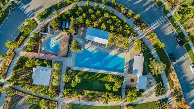an aerial view of a house with a swimming pool