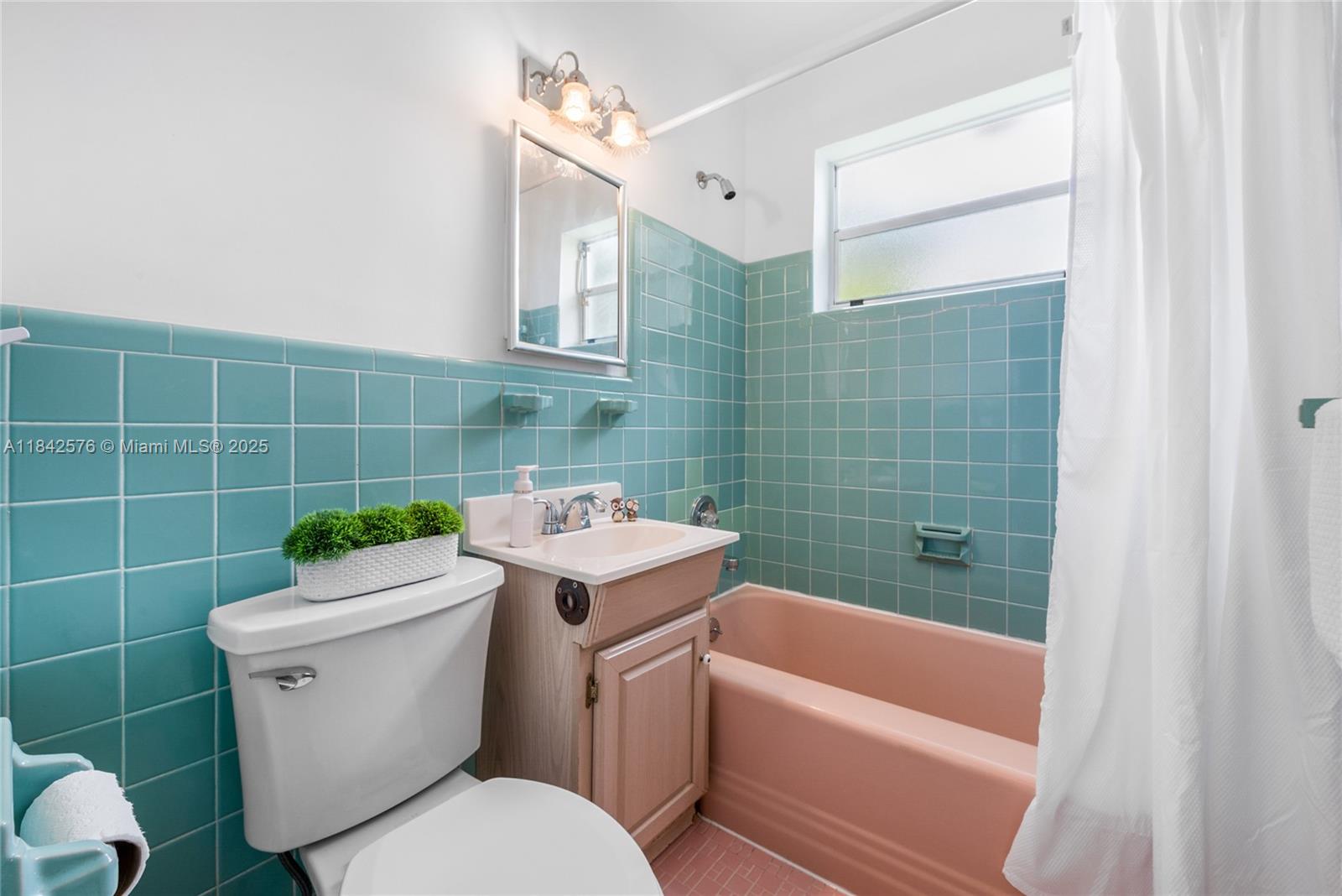 16921 Southwest 302nd Terrace Homestead, FL 33030 - Photo 12 of 14 a white toilet sitting next to a bathroom sink