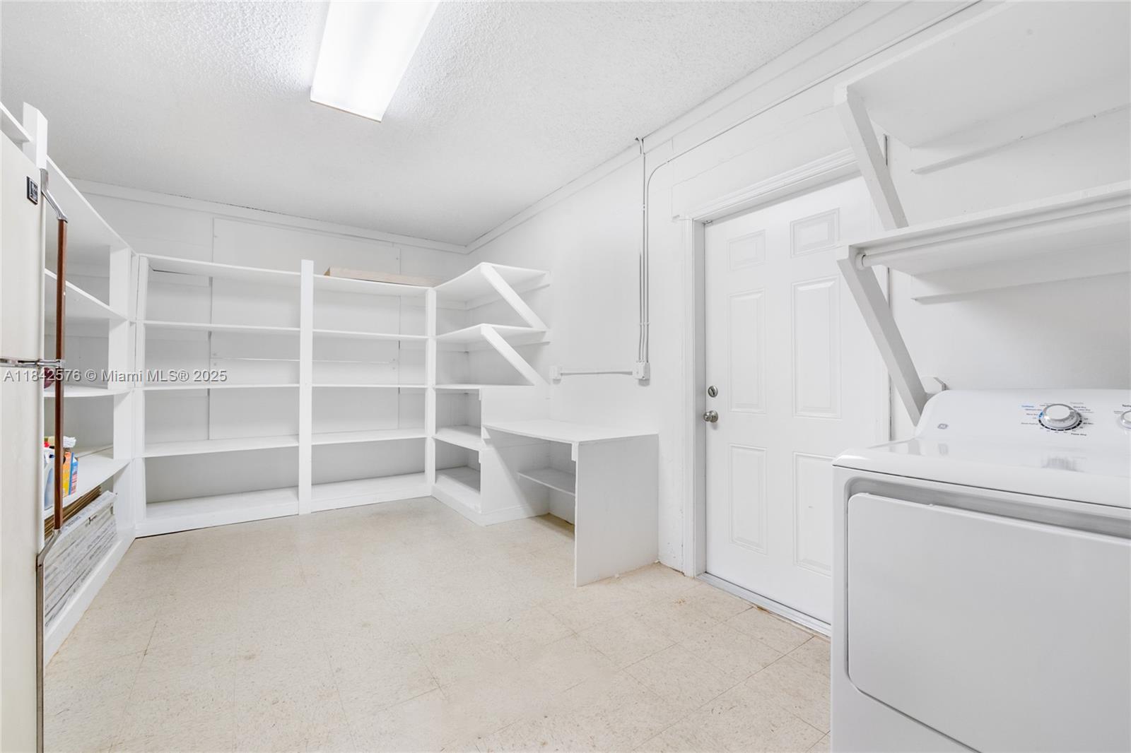 16921 Southwest 302nd Terrace Homestead, FL 33030 - Photo 13 of 14 a view of an empty room with a fireplace and a window