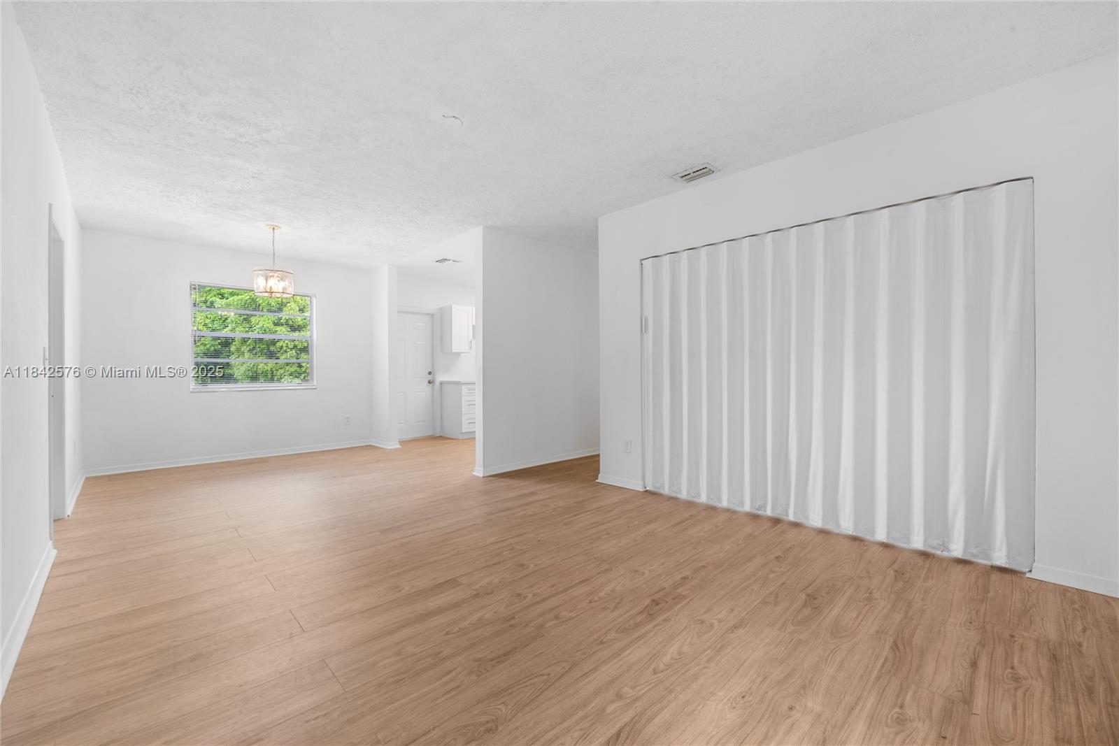 16921 Southwest 302nd Terrace Homestead, FL 33030 - Photo 3 of 14 an empty room with windows