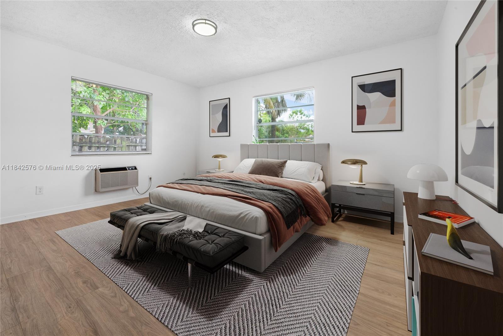 16921 Southwest 302nd Terrace Homestead, FL 33030 - Photo 9 of 14 a bedroom with a bed and wooden floor