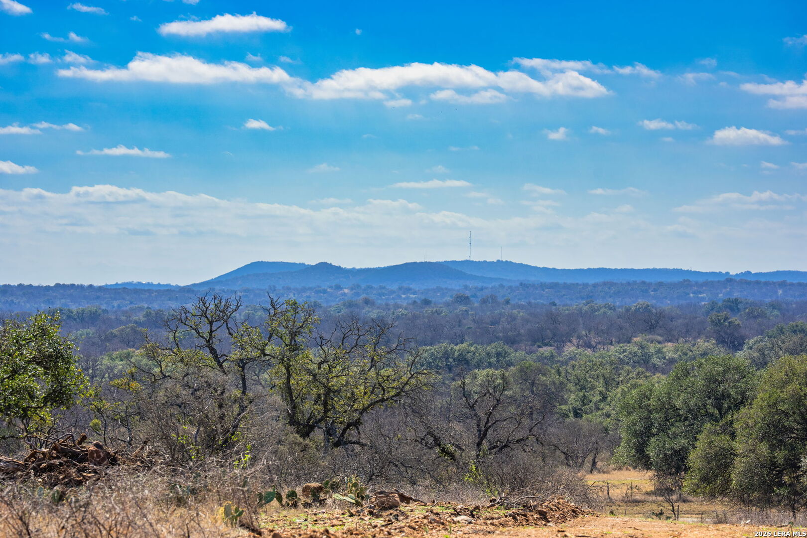3722 Ranch Road 2241 Llano, TX 78643 - Photo 2 of 41 a view of a mountain in the distance in a field
