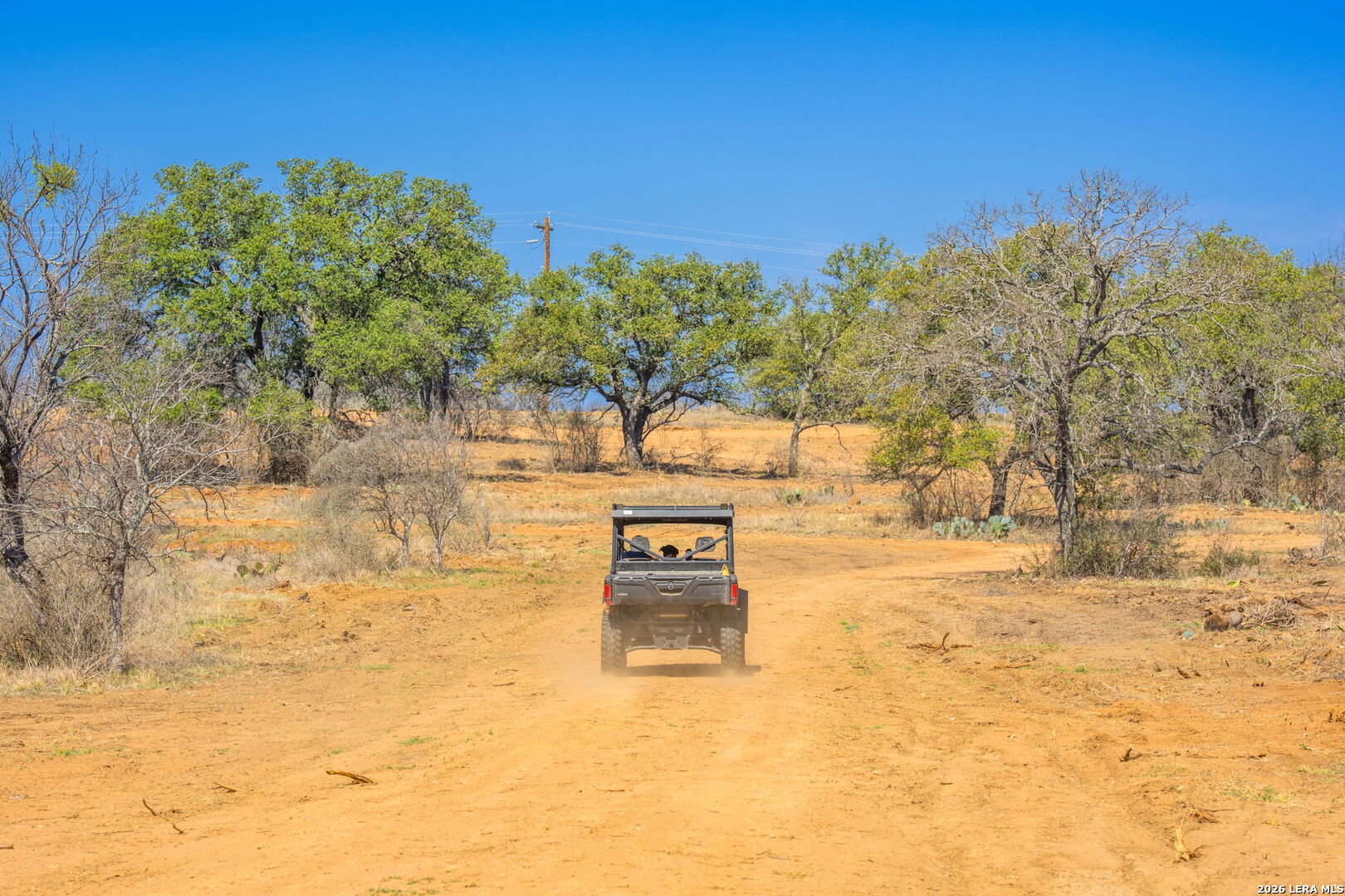 3722 Ranch Road 2241 Llano, TX 78643 - Photo 35 of 41 a view of a parking space with trees in the background