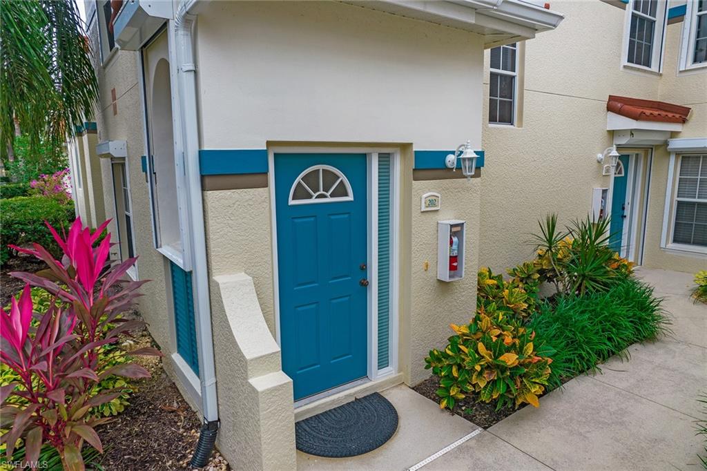 23821 Marbella Bay Road, Unit 202 Estero, FL 34135 - Photo 26 of 42 a front view of a house with entryway