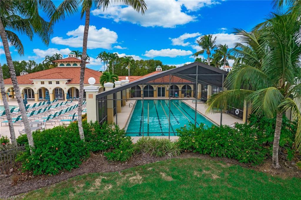 23821 Marbella Bay Road, Unit 202 Estero, FL 34135 - Photo 33 of 42 a view of a house with a yard