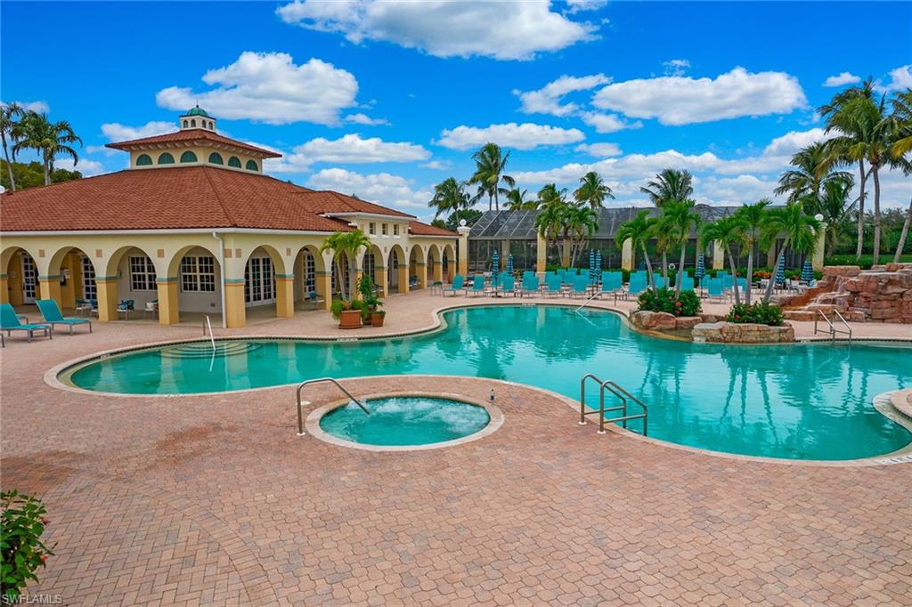 23821 Marbella Bay Road, Unit 202 Estero, FL 34135 - Photo 34 of 42 a view of a house with swimming pool and a yard