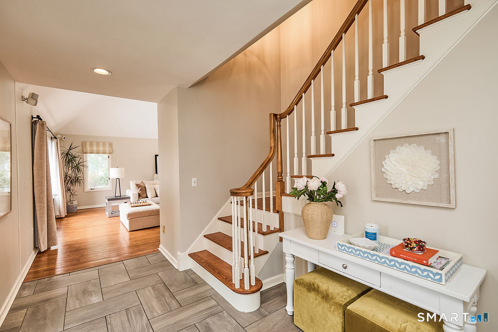 23 Harborview Road Westport, CT 06880 - Photo 15 of 35 a view of entryway kitchen and hall with wooden floor