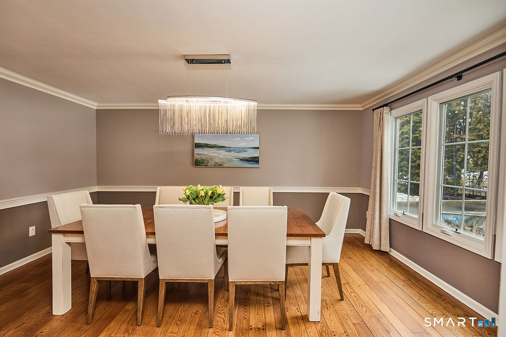 23 Harborview Road Westport, CT 06880 - Photo 16 of 35 a view of a dining room with furniture and wooden floor