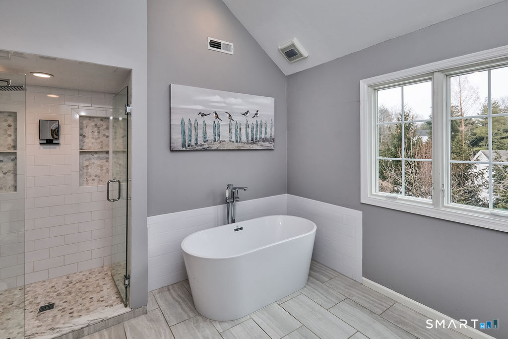 23 Harborview Road Westport, CT 06880 - Photo 20 of 35 a bathroom with a bathtub and shower