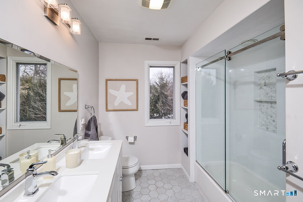 23 Harborview Road Westport, CT 06880 - Photo 22 of 35 a bathroom with a sink toilet and shower