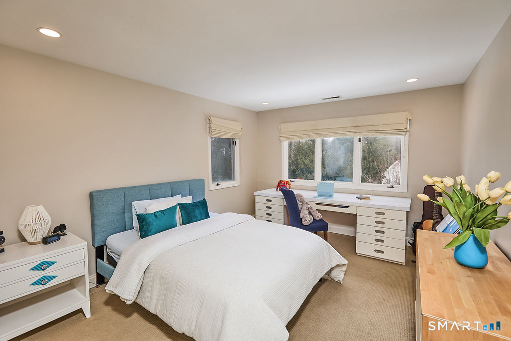 23 Harborview Road Westport, CT 06880 - Photo 23 of 35 a bedroom with a bed and a table