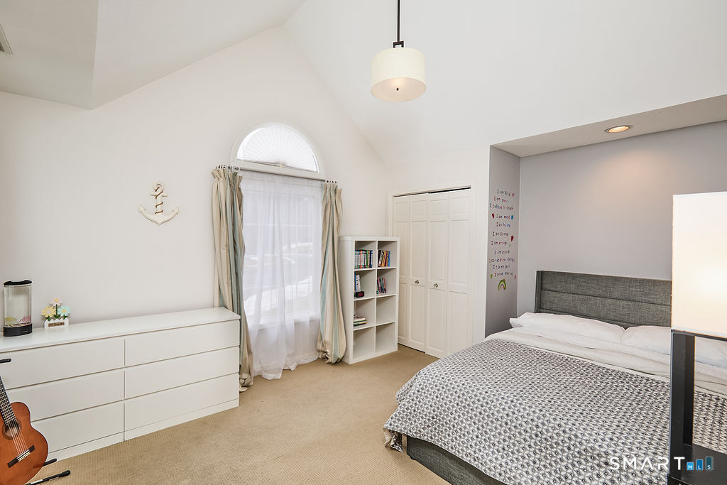 23 Harborview Road Westport, CT 06880 - Photo 24 of 35 a bedroom with a bed and a walk in closet