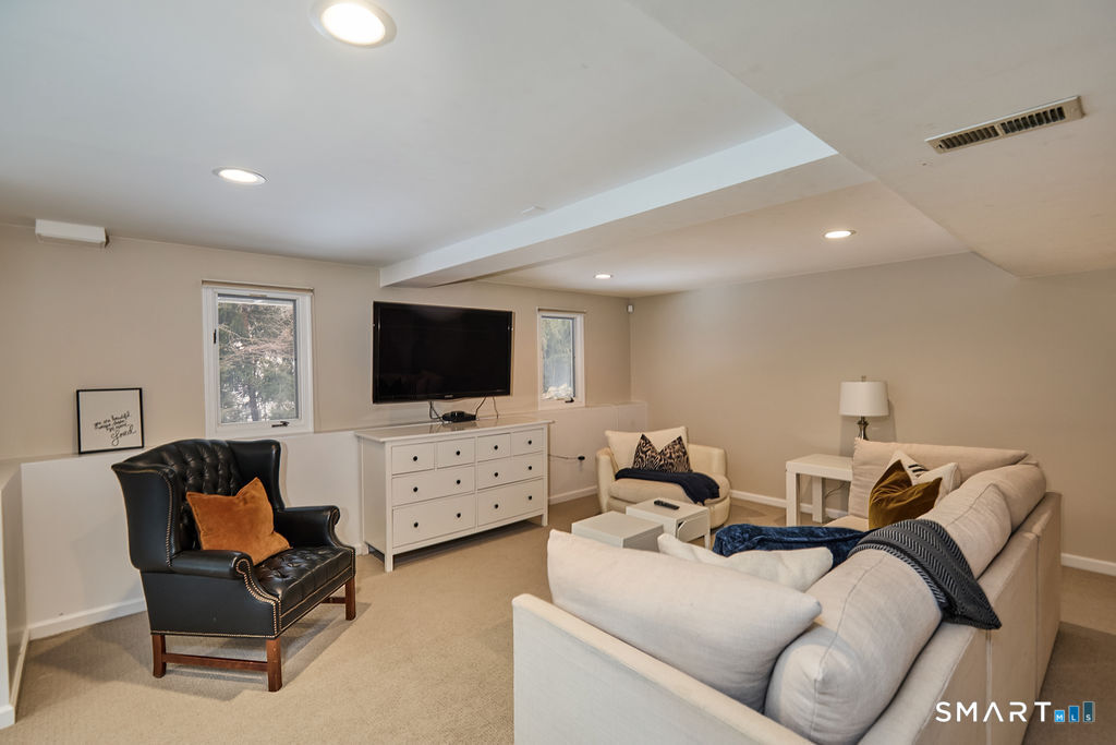 23 Harborview Road Westport, CT 06880 - Photo 26 of 35 a living room with furniture and a flat screen tv