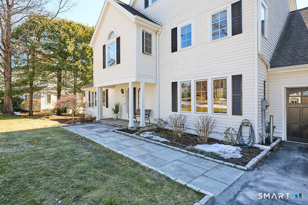 23 Harborview Road Westport, CT 06880 - Photo 27 of 35 a front view of a house with a yard