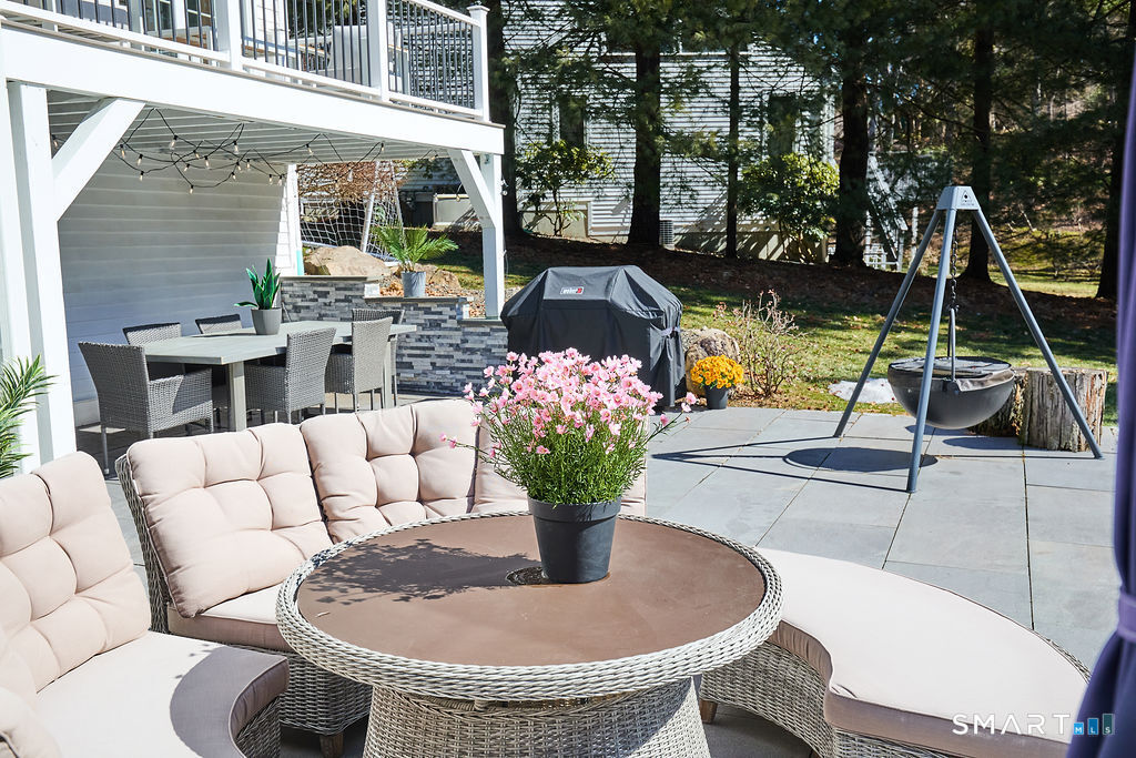 23 Harborview Road Westport, CT 06880 - Photo 31 of 35 a view of a patio with a table and chairs
