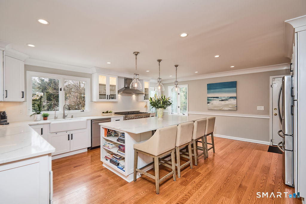 23 Harborview Road Westport, CT 06880 - Photo 7 of 35 a large kitchen with a table and chairs in it