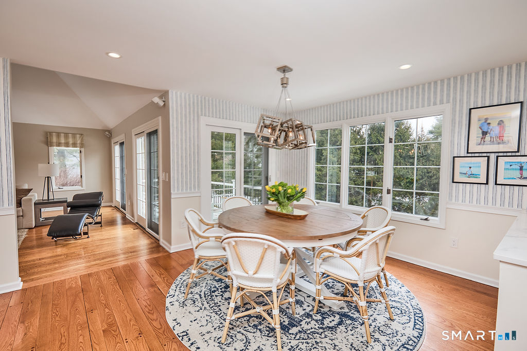 23 Harborview Road Westport, CT 06880 - Photo 10 of 35 a dining room with furniture a chandelier and wooden floor