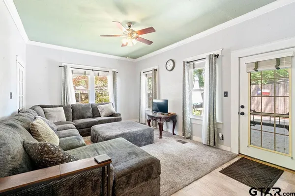 a living room with furniture and a window