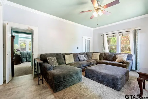 a living room with furniture and a window