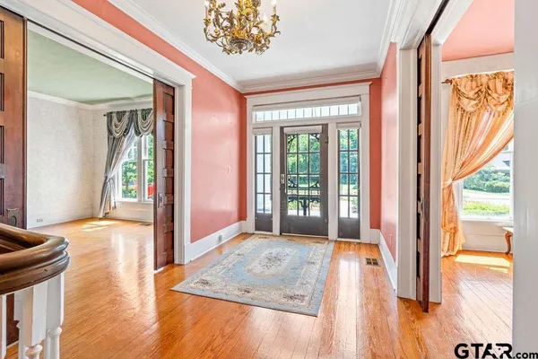 a view of an entryway with wooden floor