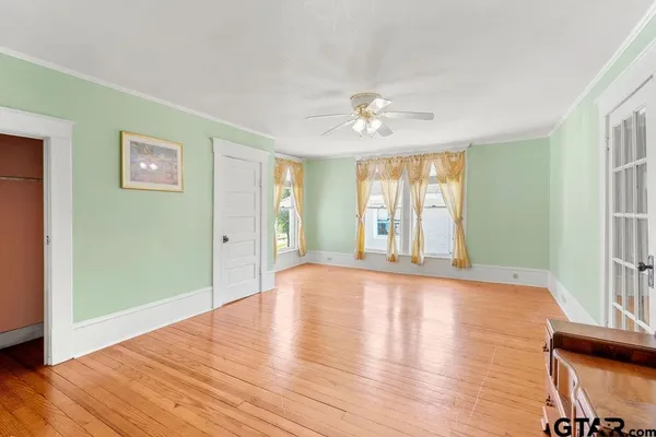 a room with furniture and a large window
