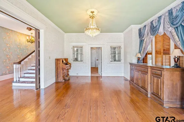 a view of an entryway with wooden floor