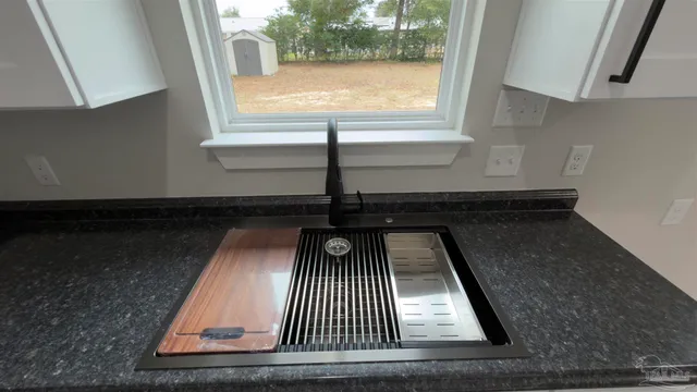 a kitchen with a sink and cabinets