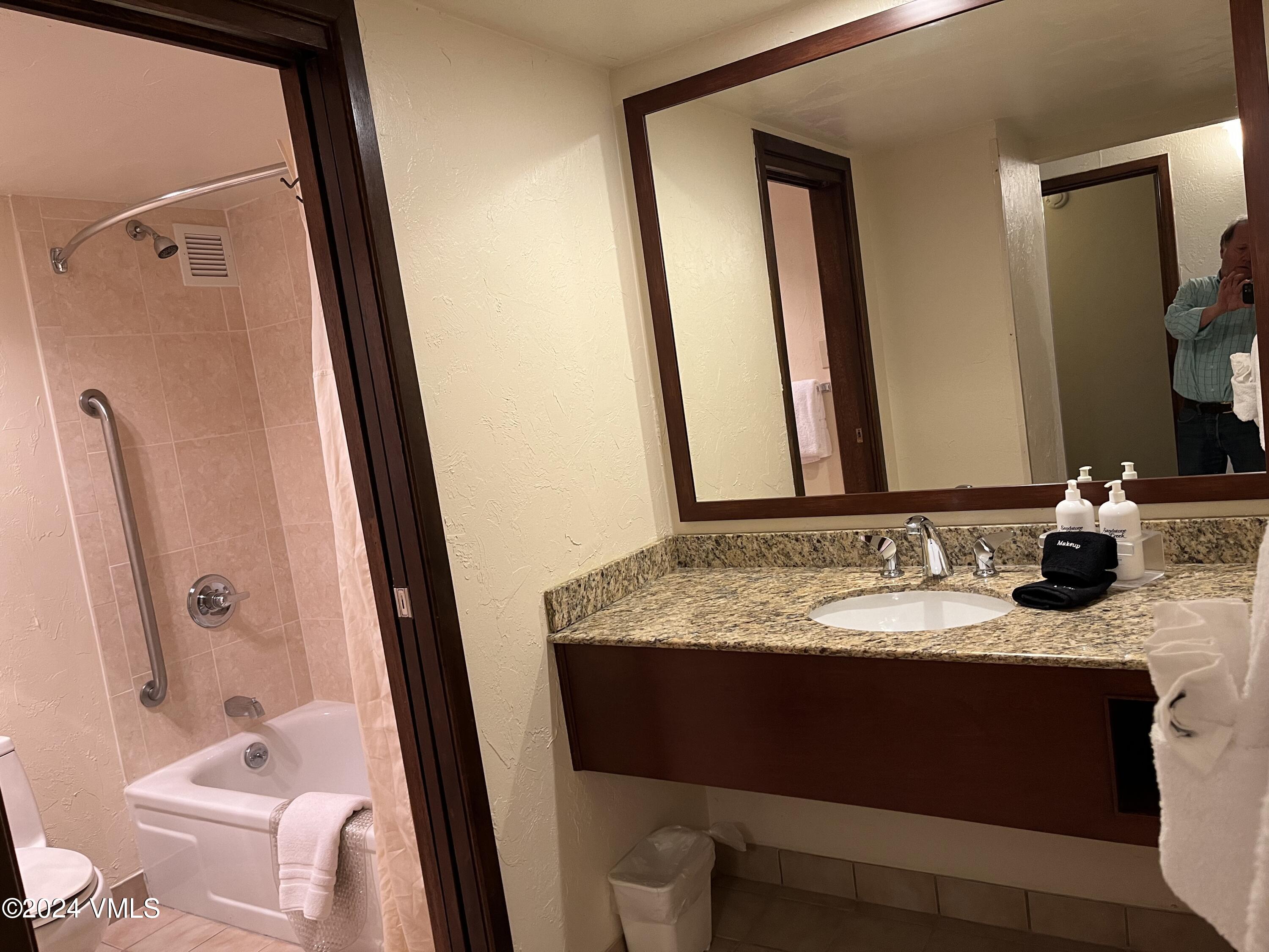 1020 Vail View Drive, Unit 210824 Vail, CO 81657 - Photo 5 of 19 a bathroom with a granite countertop sink toilet and shower a mirror