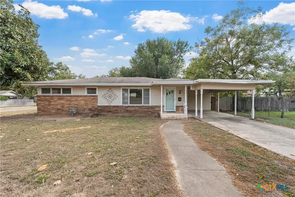 front view of a house with a patio