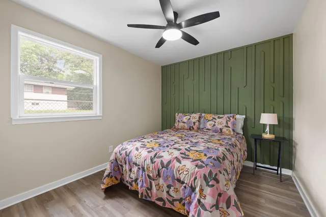 a bedroom with a bed and a window