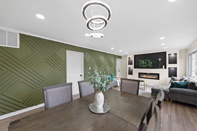 a living room with furniture potted plant and a large window