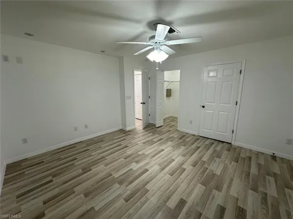 a view of a livingroom with a chandelier fan