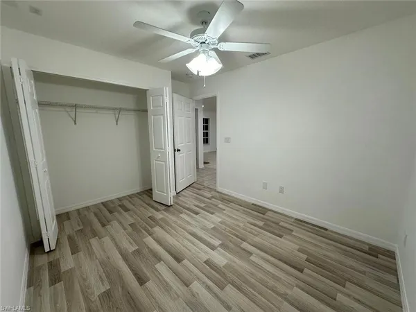 a bathroom with a toilet and a bath tub