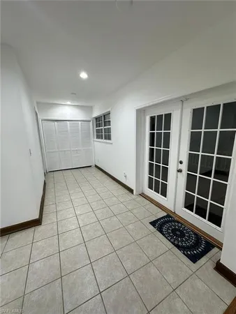 a view of a livingroom with wooden floor and furniture