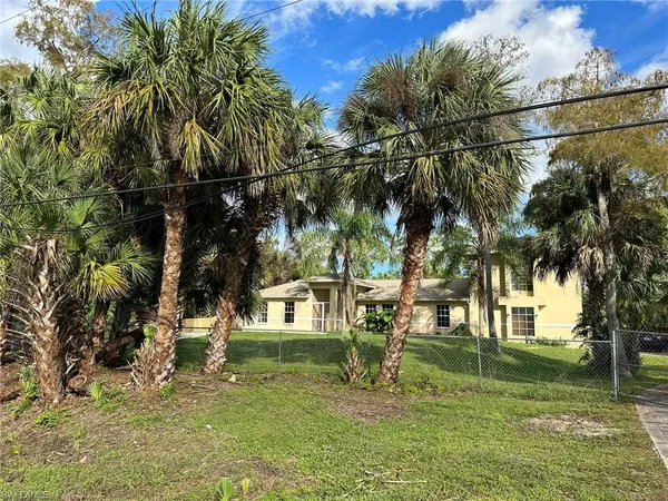 a view of a playground with a house