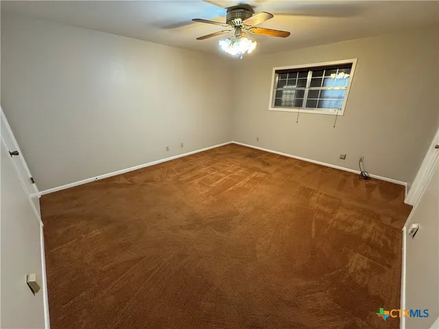 en view of an empty room with a window