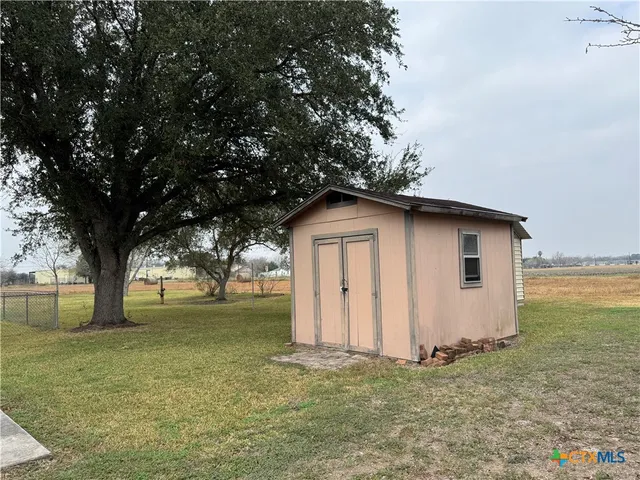 a house with a tree in front of it